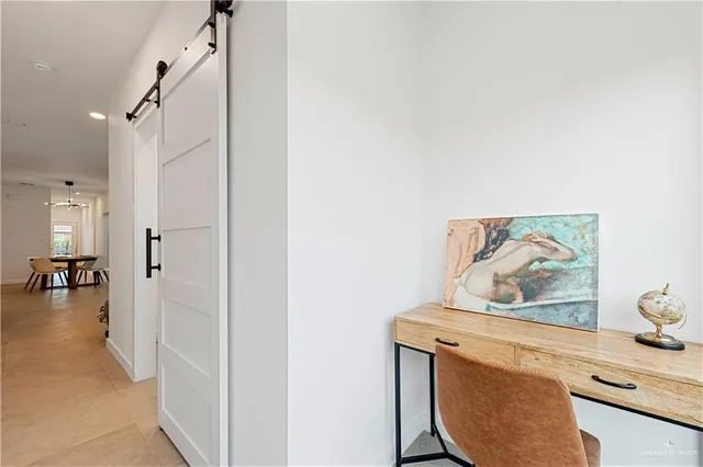 a view of a hallway with staircase