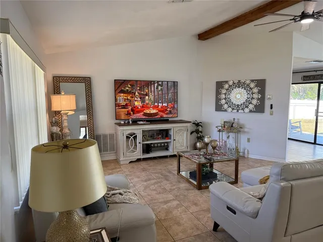 a living room with furniture and a window