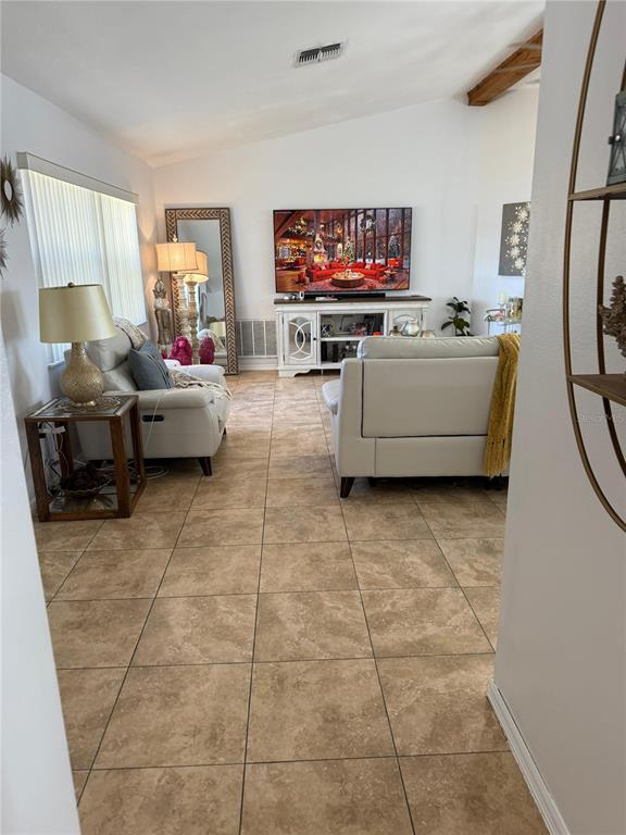 5389 Frost Road Spring Hill, FL 34606 - Photo 15 of 60 a living room with furniture and a flat screen tv