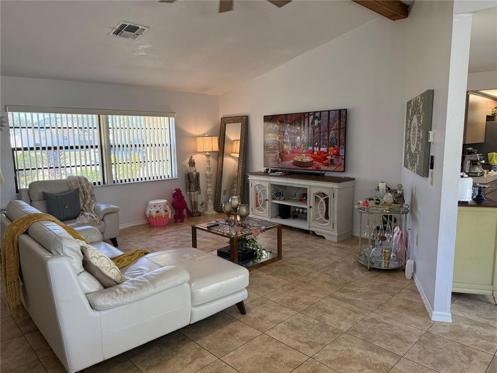 5389 Frost Road Spring Hill, FL 34606 - Photo 20 of 60 a living room with furniture and a flat screen tv