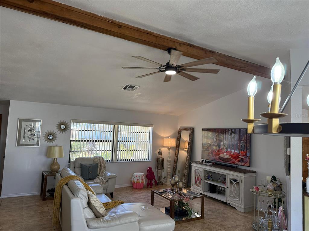 5389 Frost Road Spring Hill, FL 34606 - Photo 21 of 60 a living room with furniture and a flat screen tv