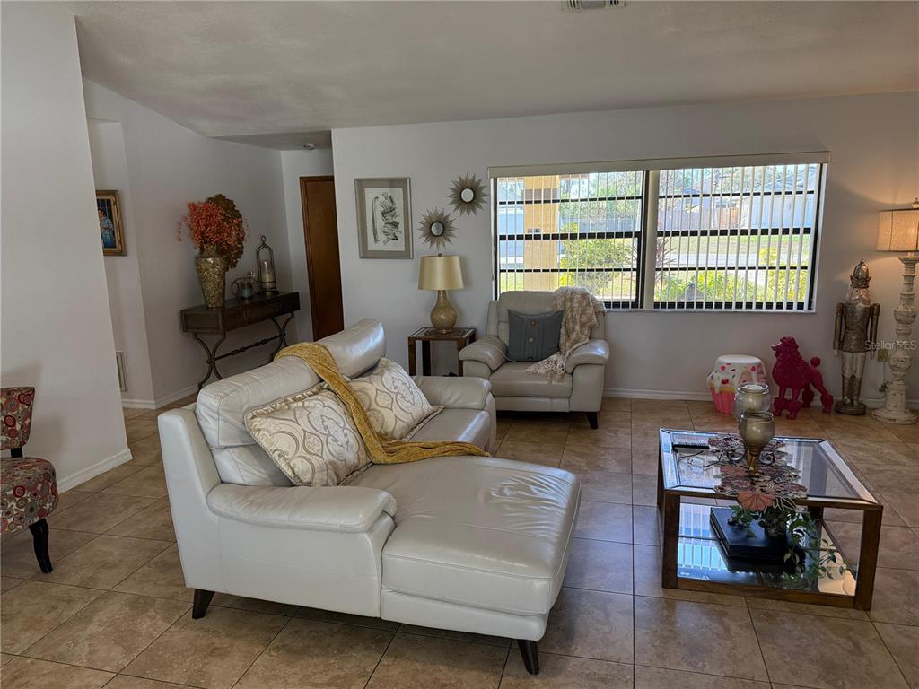 5389 Frost Road Spring Hill, FL 34606 - Photo 22 of 60 a living room with furniture and a window