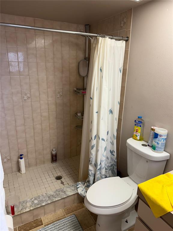 5389 Frost Road Spring Hill, FL 34606 - Photo 29 of 60 a bathroom with a sink toilet and shower