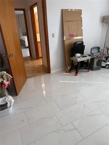 a hallway with washer and dryer