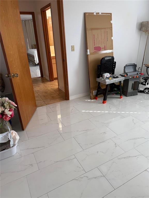 5389 Frost Road Spring Hill, FL 34606 - Photo 34 of 60 a view of a workspace with furniture and a window