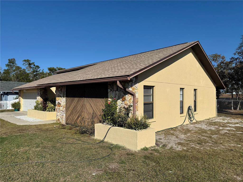 5389 Frost Road Spring Hill, FL 34606 - Photo 4 of 60 a view of a house with a yard