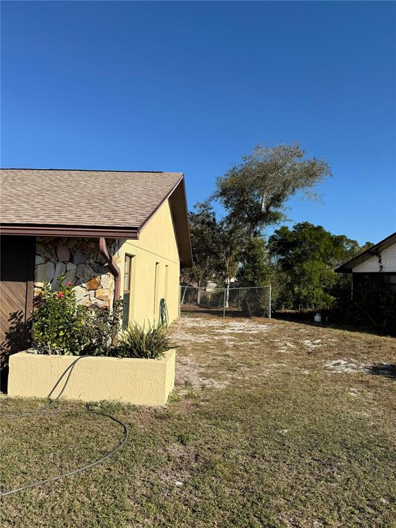 5389 Frost Road Spring Hill, FL 34606 - Photo 6 of 60 a front view of a house with a yard
