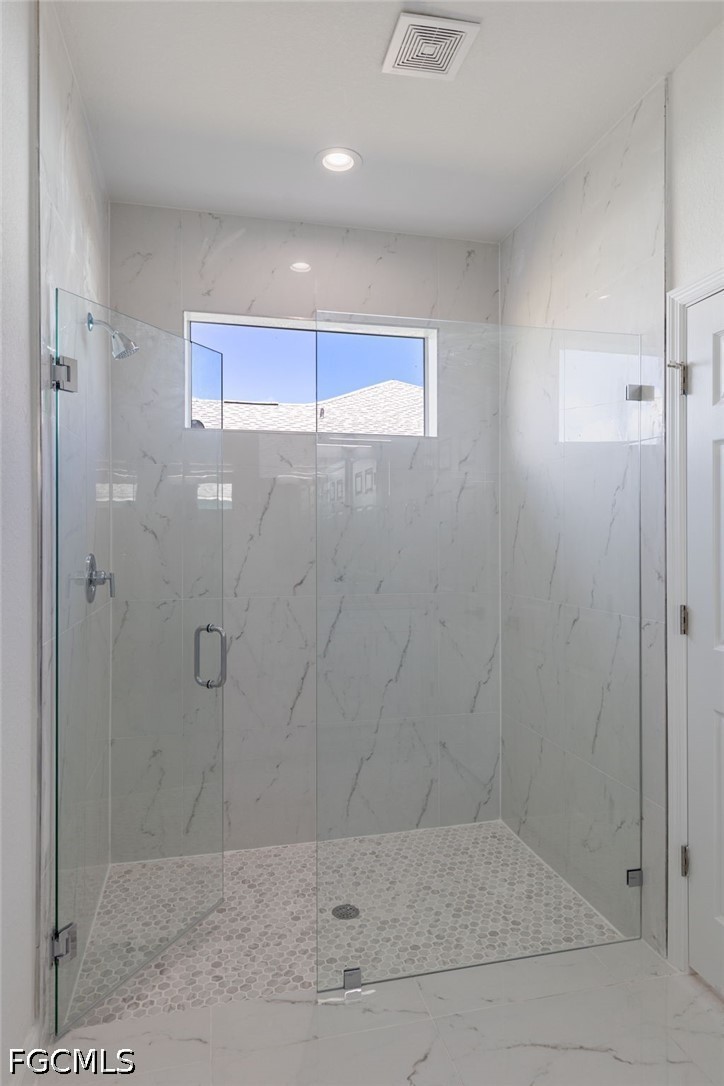 3408 14th Street Southwest Lehigh Acres, FL 33976 - Photo 18 of 24 a bathroom with a shower
