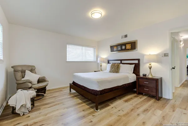 a bedroom with a bed and furniture