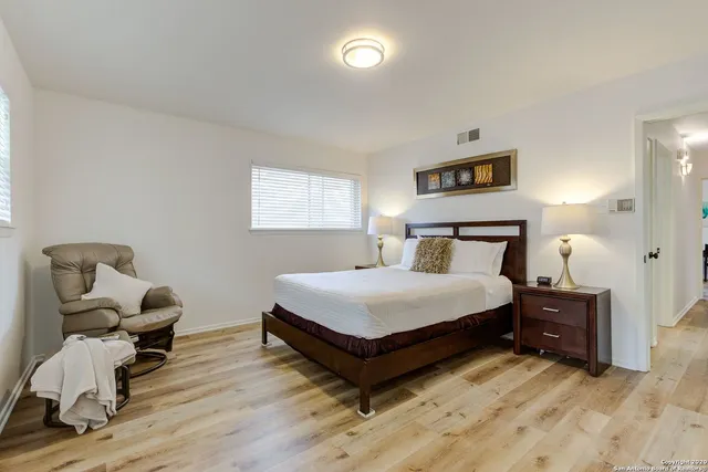 a bedroom with a bed and furniture