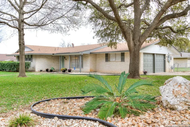 front view of a house with a garden