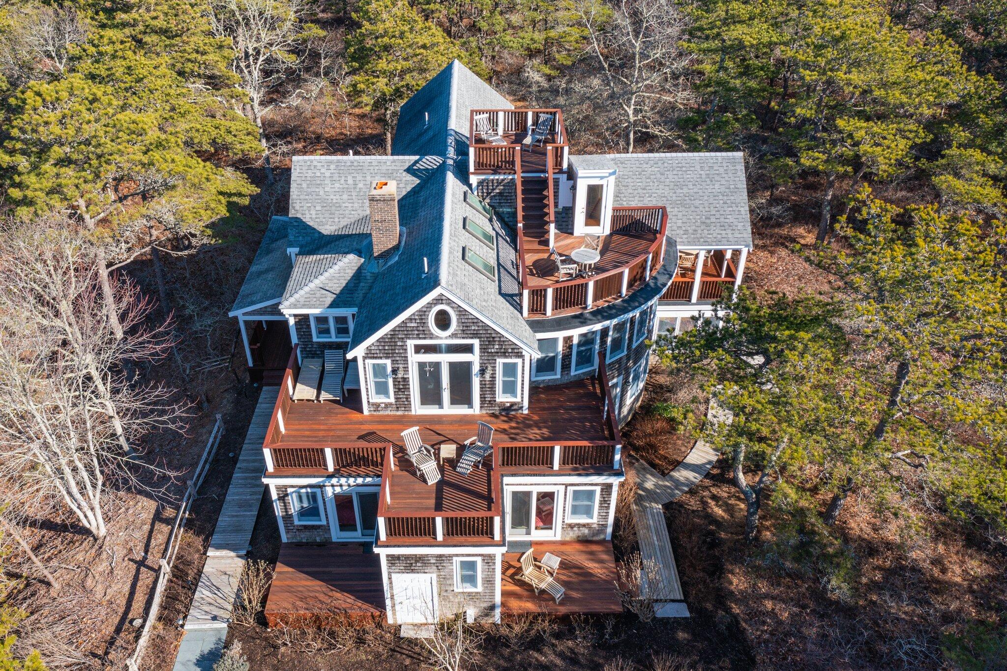 aerial view of a house with a yard and balcony