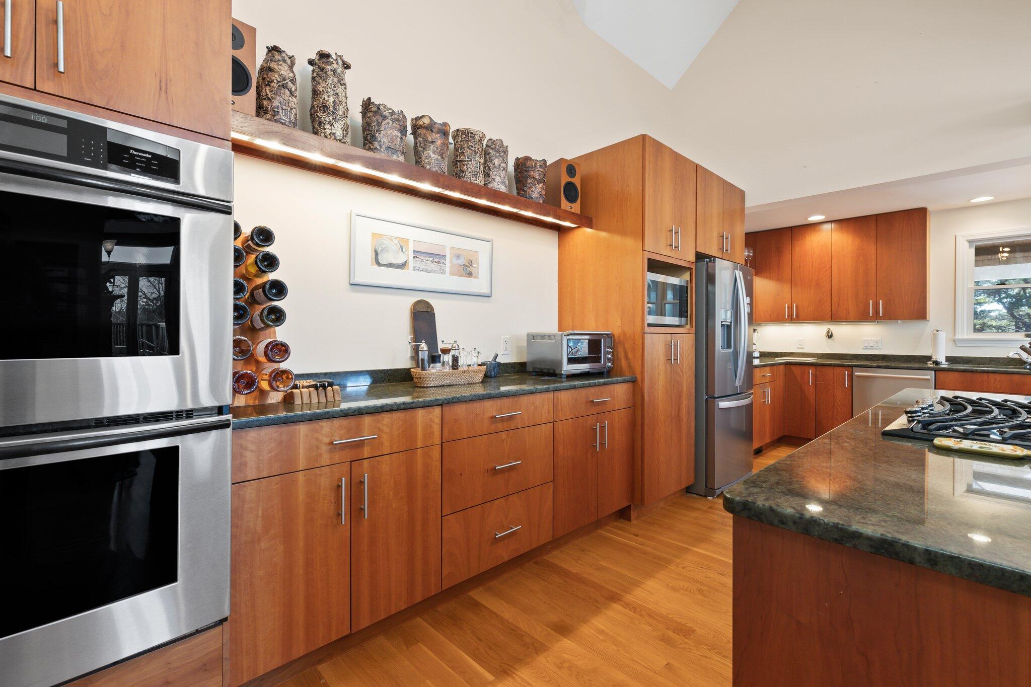 11 Sandy Lane Truro, MA 02666 - Photo 17 of 98 a kitchen with stainless steel appliances granite countertop a refrigerator and a stove top oven
