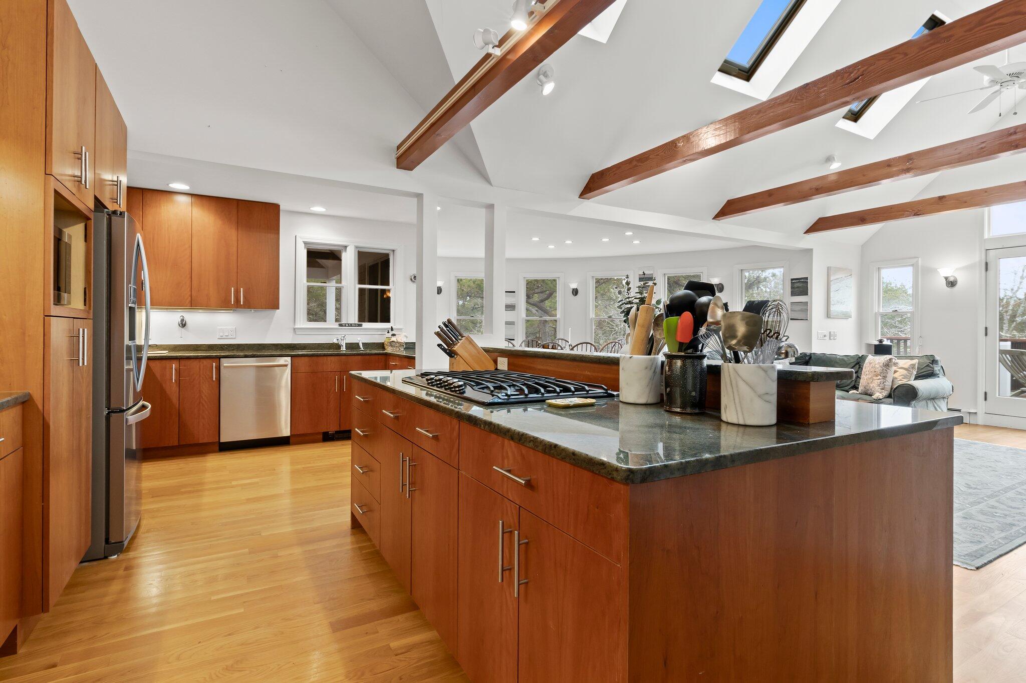 11 Sandy Lane Truro, MA 02666 - Photo 18 of 98 a kitchen with stainless steel appliances granite countertop a sink and a refrigerator