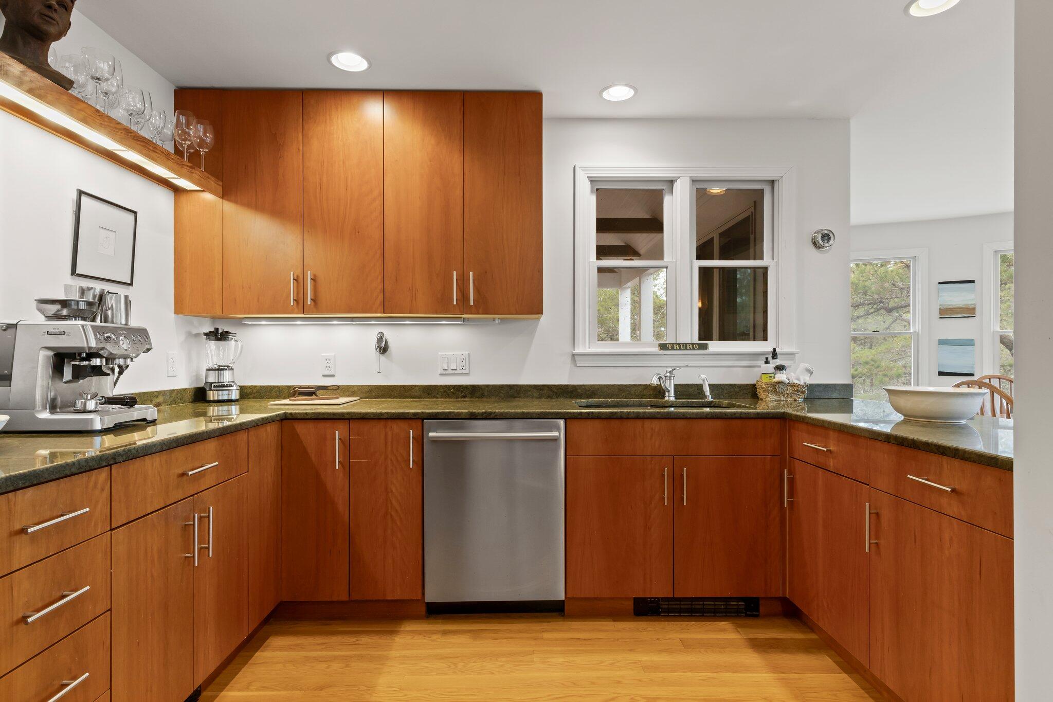 11 Sandy Lane Truro, MA 02666 - Photo 20 of 98 a kitchen with stainless steel appliances granite countertop wooden cabinets a sink and dishwasher