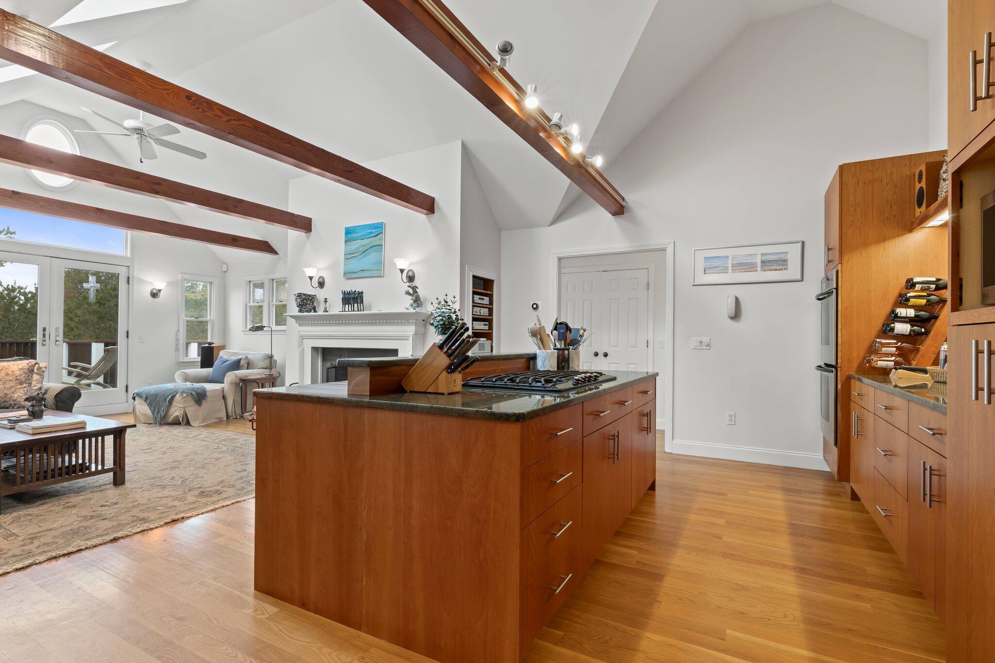 11 Sandy Lane Truro, MA 02666 - Photo 22 of 98 a living room with stainless steel appliances granite countertop furniture a fireplace and a large window