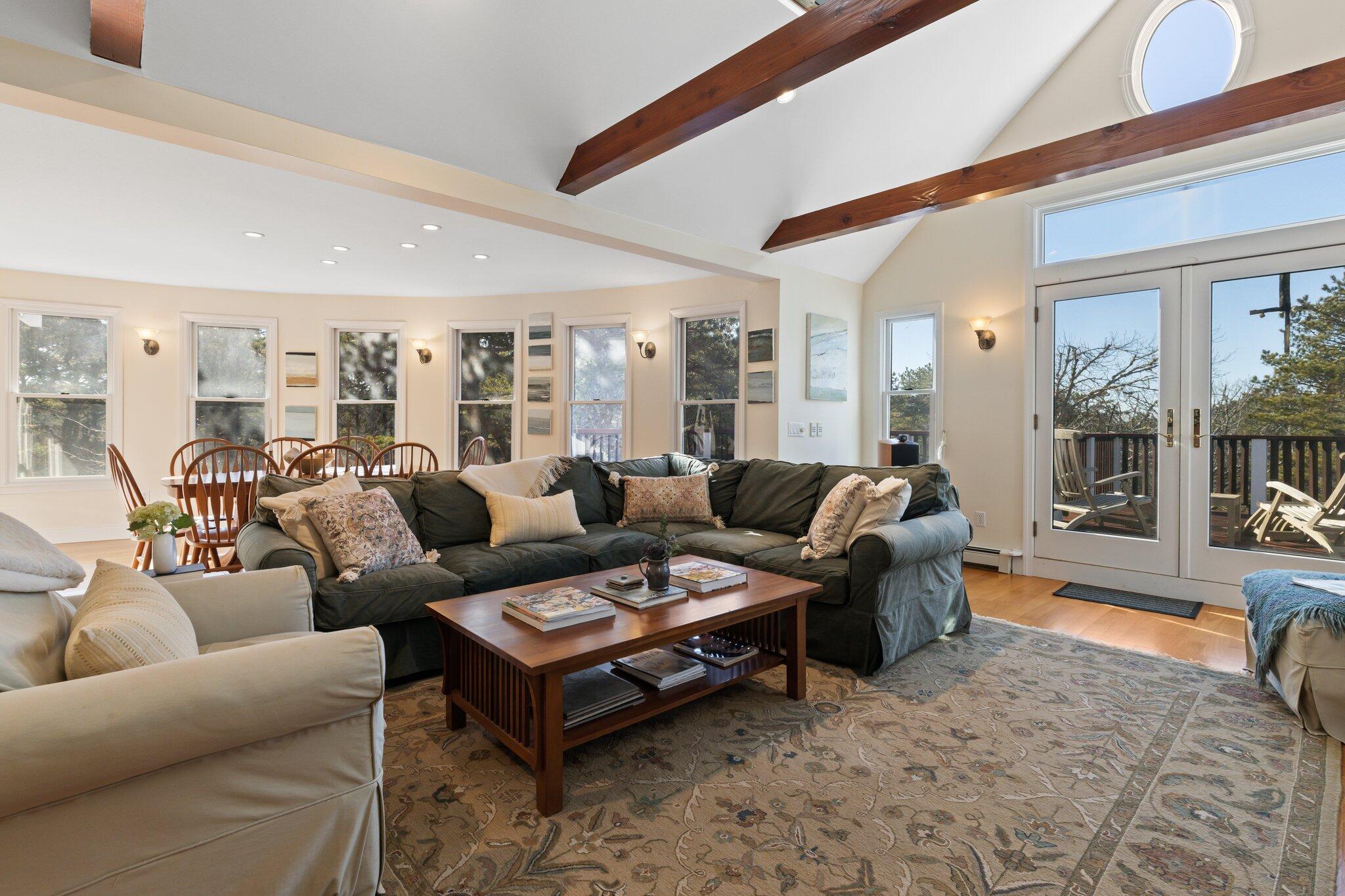 11 Sandy Lane Truro, MA 02666 - Photo 26 of 98 a living room with furniture a rug and a large window