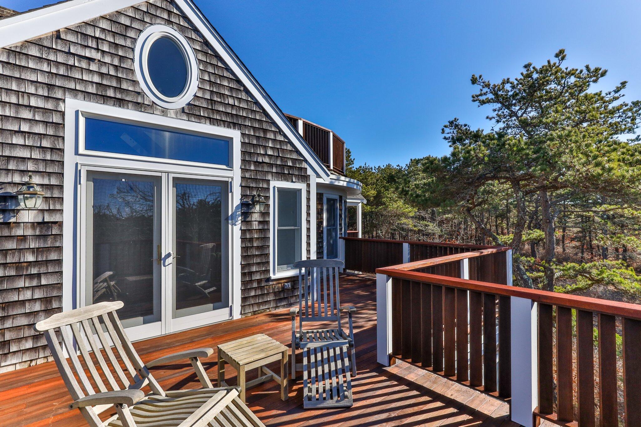 11 Sandy Lane Truro, MA 02666 - Photo 34 of 98 a view of a chair and tables in the balcony