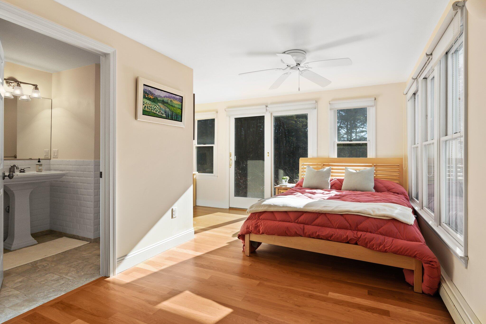 11 Sandy Lane Truro, MA 02666 - Photo 47 of 98 a bedroom with a bed and a large window with balcony view