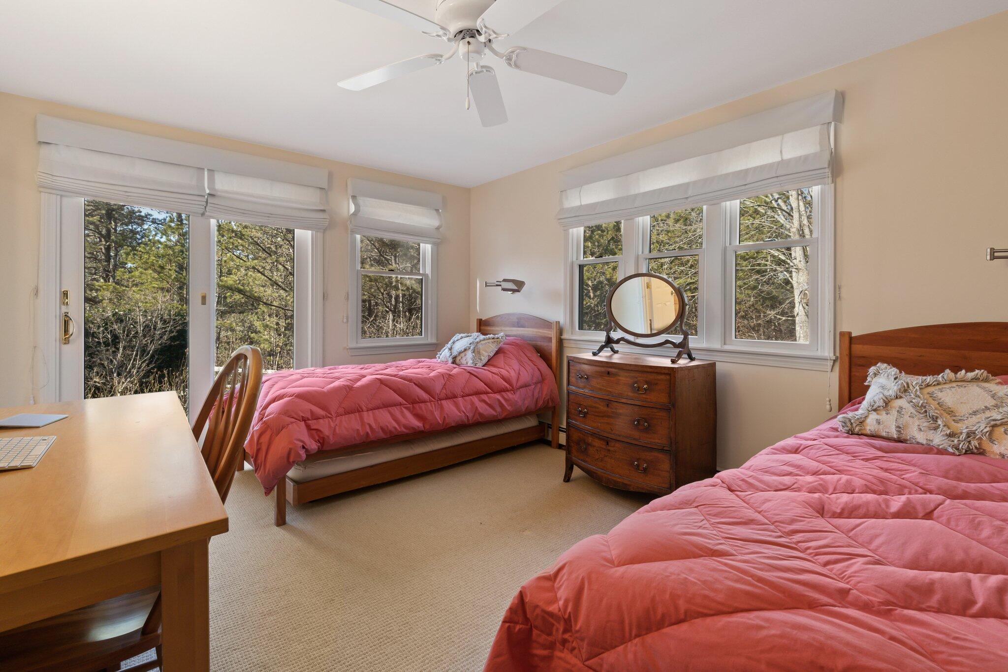 11 Sandy Lane Truro, MA 02666 - Photo 50 of 98 a bedroom with a bed and large windows