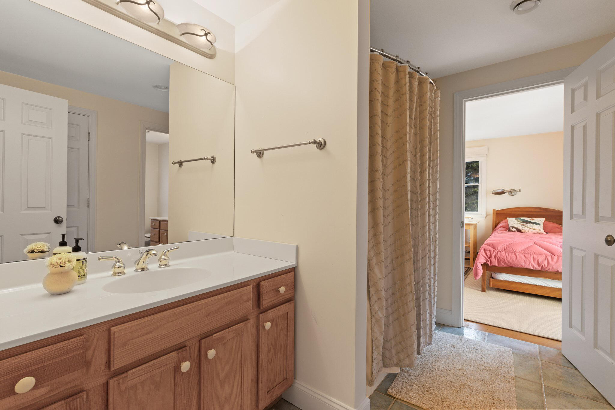 11 Sandy Lane Truro, MA 02666 - Photo 52 of 98 a en suite bathroom with a sink a vanity and a mirror
