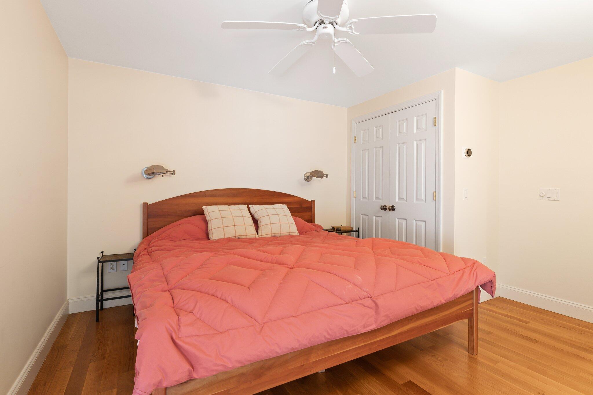 11 Sandy Lane Truro, MA 02666 - Photo 58 of 98 a bedroom with a bed and a chandelier