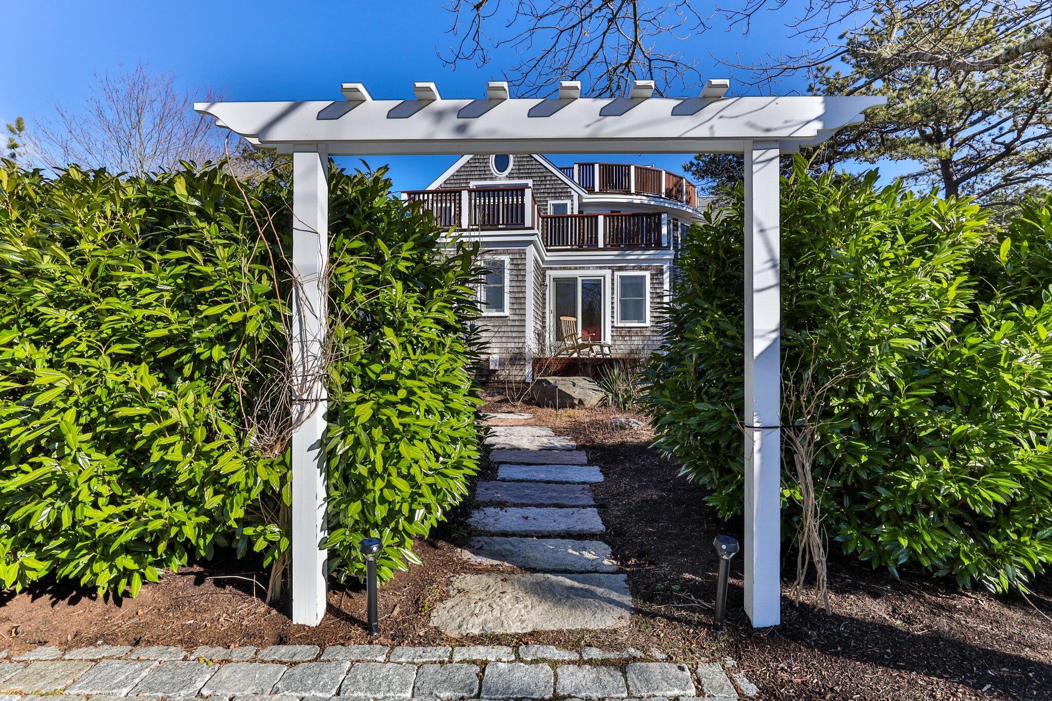 11 Sandy Lane Truro, MA 02666 - Photo 6 of 98 a front view of a house with a yard