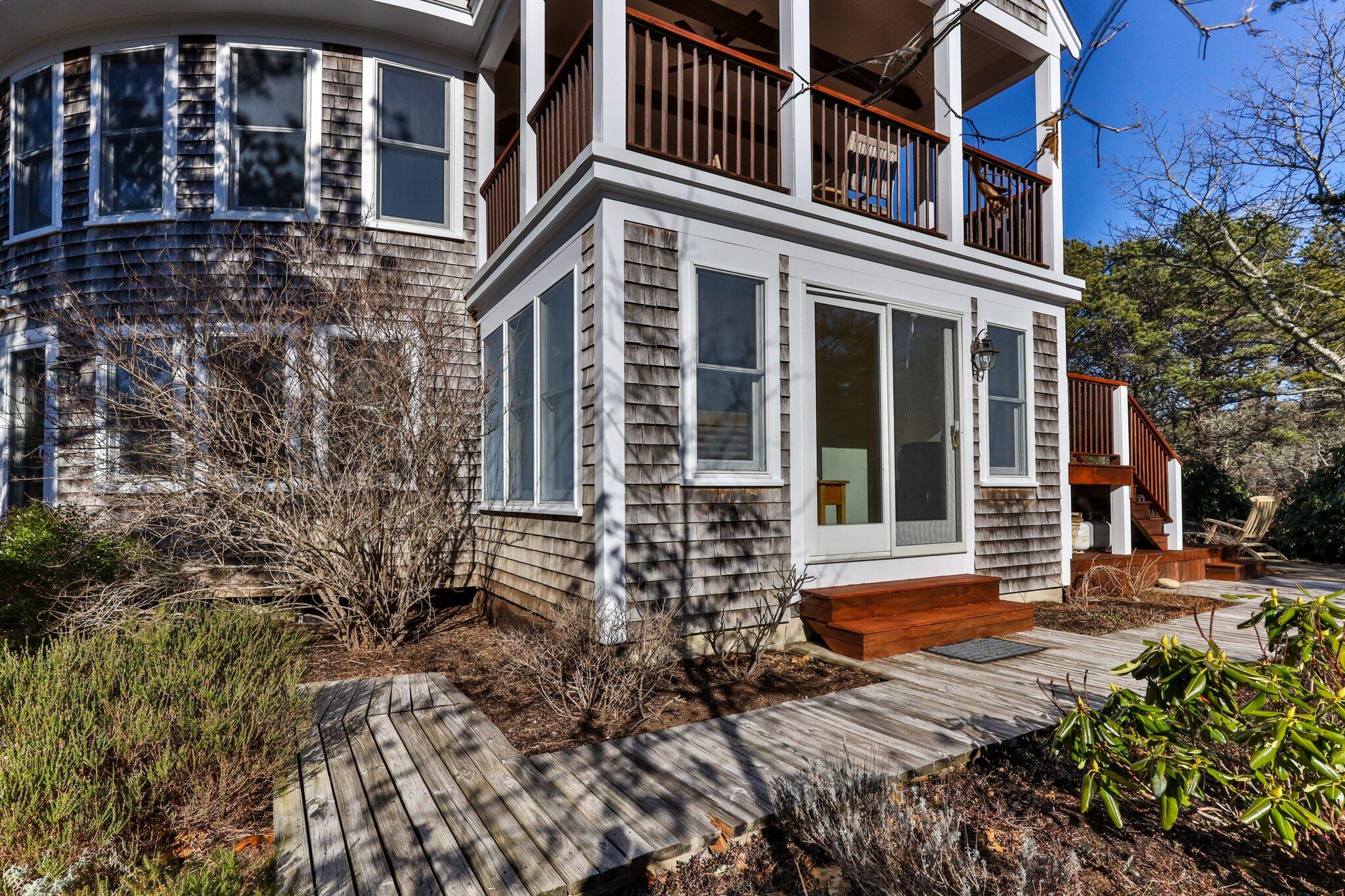 11 Sandy Lane Truro, MA 02666 - Photo 76 of 98 front view of a brick house with a large window