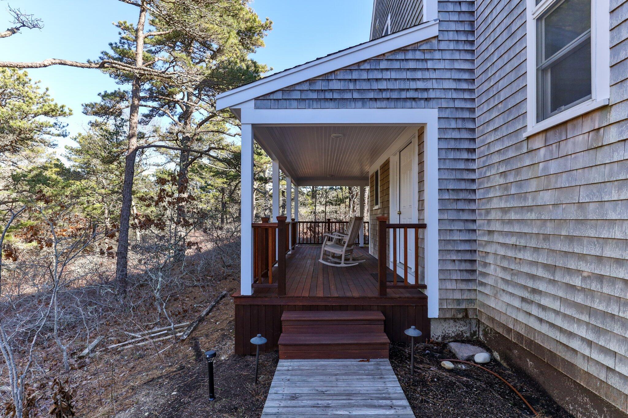 11 Sandy Lane Truro, MA 02666 - Photo 10 of 98 a view of a pathway of a house with wooden deck