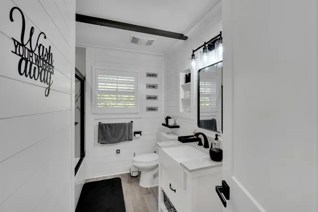 a bed room with a bed and a window