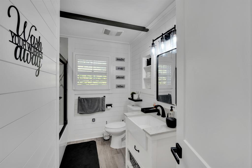 846 Truman Circle Lancaster, TX 75146 - Photo 12 of 29 a bathroom with a sink and a mirror