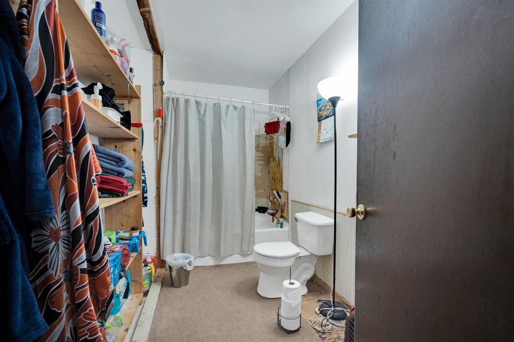 846 Truman Circle Lancaster, TX 75146 - Photo 16 of 29 a view of walk in closet with clothes and shoes