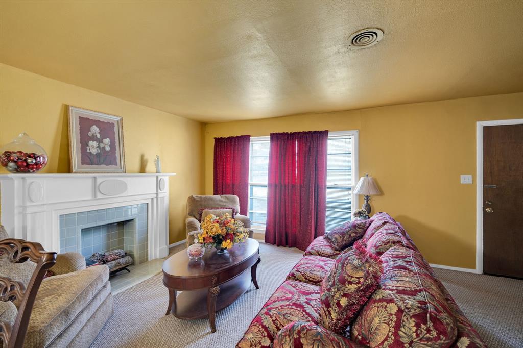 846 Truman Circle Lancaster, TX 75146 - Photo 22 of 29 a spacious bedroom with a bed and a fireplace