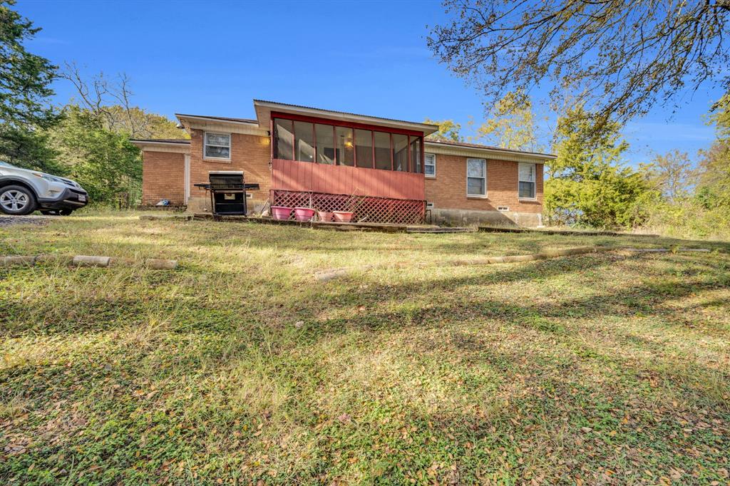 846 Truman Circle Lancaster, TX 75146 - Photo 5 of 29 a front view of a house with a garden