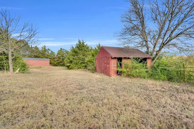 a bedroom with a large bed and a bookshelf