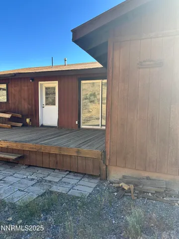 a view of a balcony with wooden floor