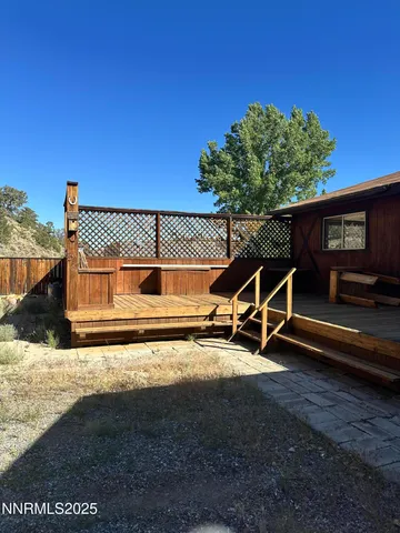 a view of a wooden floor and a fence