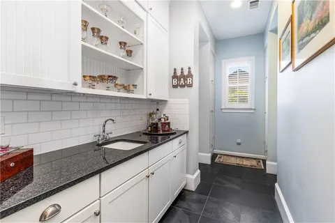 a kitchen with a sink and cabinets