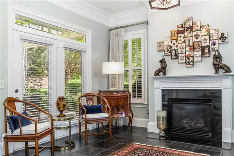 a living room with furniture and a fireplace