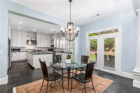 a dining room filled with furniture and window