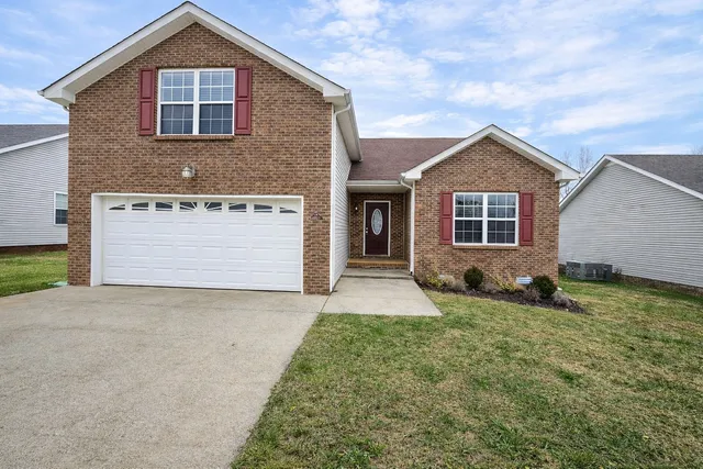 a front view of a house with yard