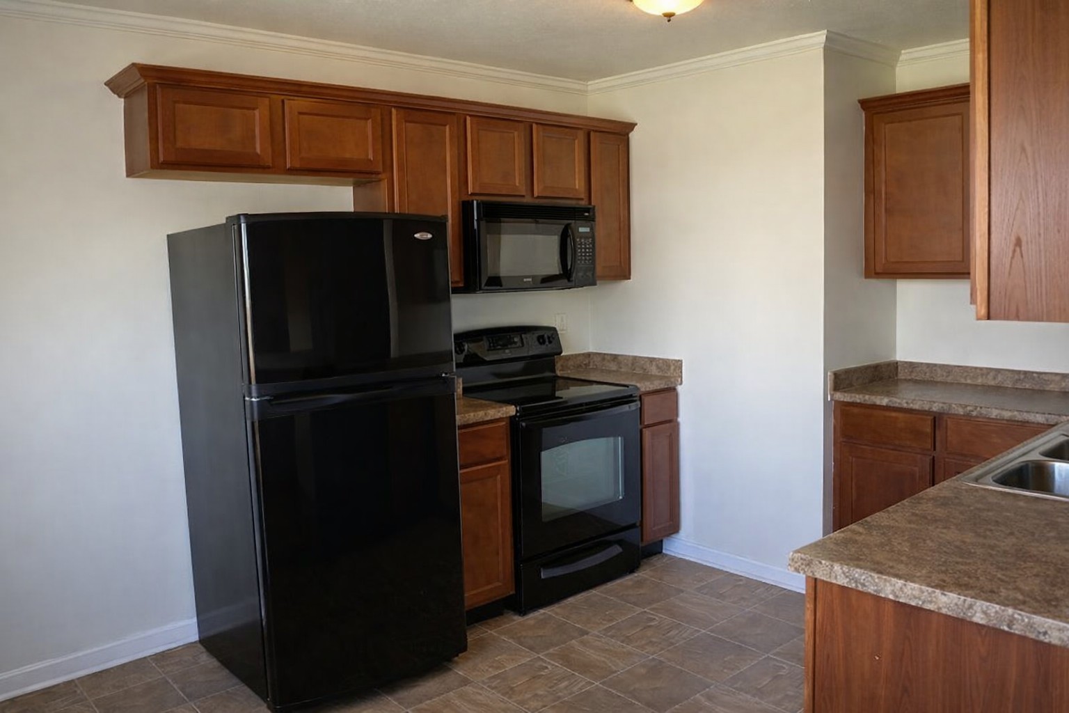 1809 Abrams Road Clarksville, TN 37042 - Photo 13 of 43 a kitchen with a refrigerator stove and microwave