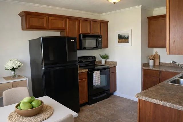 a kitchen with a sink and a refrigerator