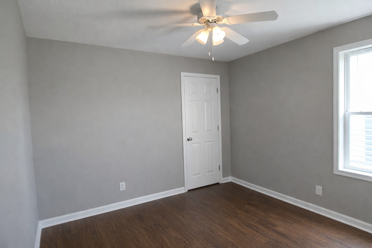 1809 Abrams Road Clarksville, TN 37042 - Photo 25 of 43 an empty room with wooden floor closet and windows