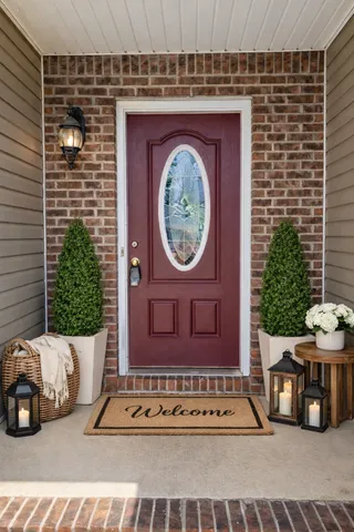 a view of a door and a car parked in the balcony