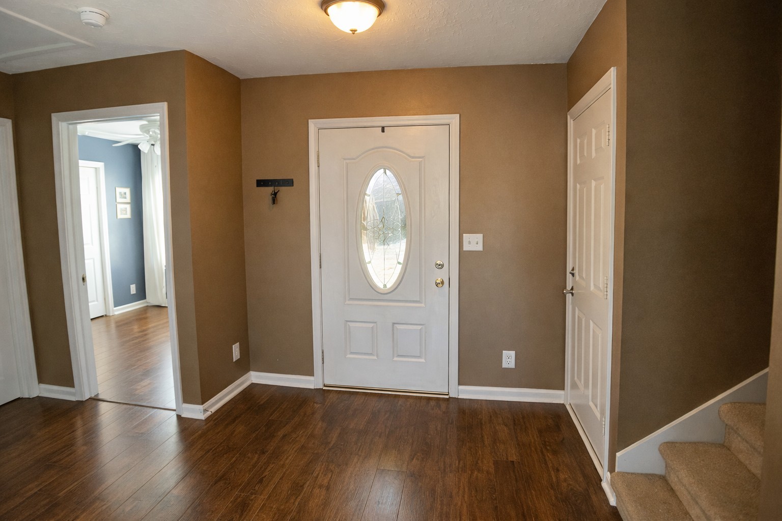 1809 Abrams Road Clarksville, TN 37042 - Photo 4 of 43 an empty room with wooden floor and mirror