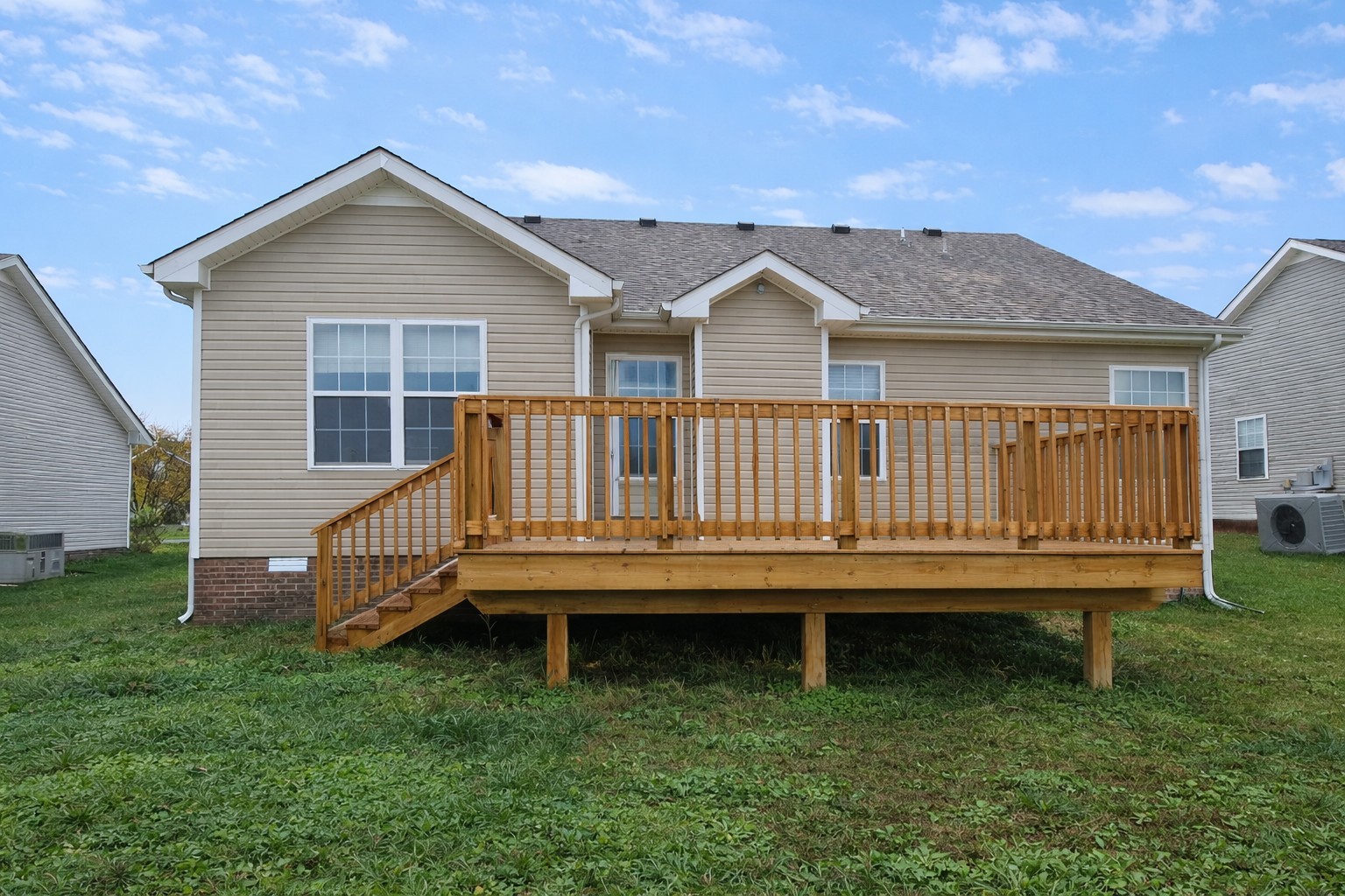 1809 Abrams Road Clarksville, TN 37042 - Photo 42 of 43 a view of a house with a wooden deck and a yard