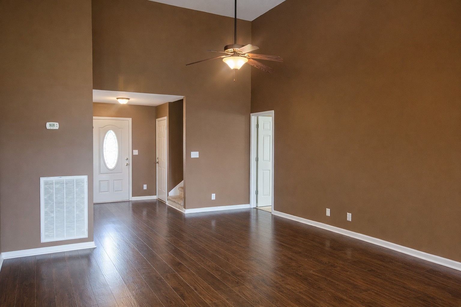 1809 Abrams Road Clarksville, TN 37042 - Photo 7 of 43 a view of an empty room with wooden floor and a window