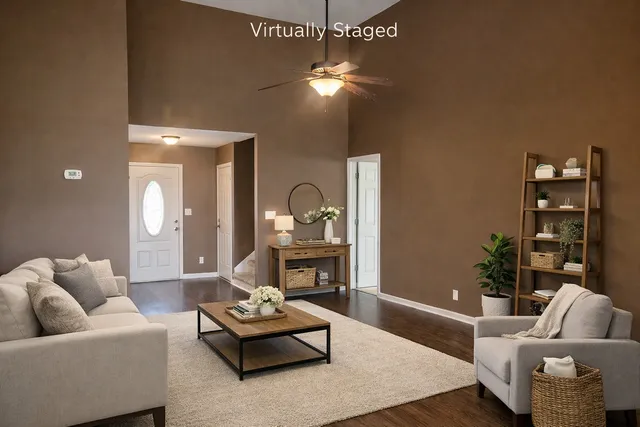 a living room with furniture and a chandelier