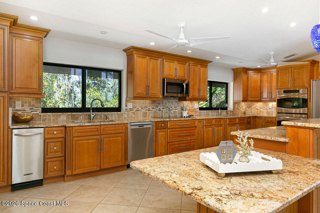 110 Barnacle Place Rockledge, FL 32955 - Photo 14 of 66 Upstairs Kitchen Staging